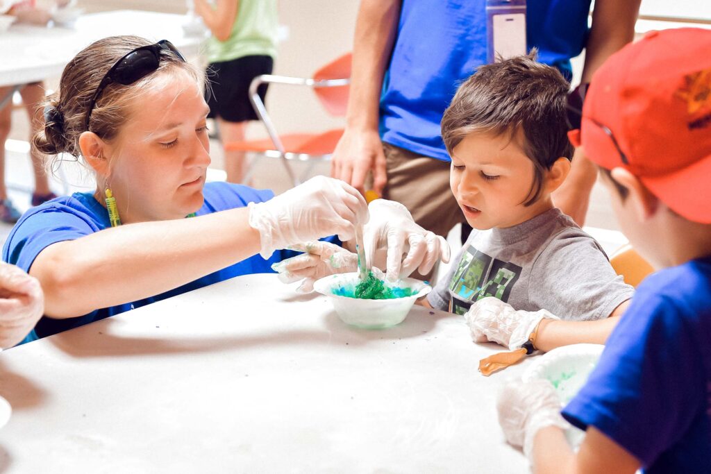 Campers learning how to do a science experiment.